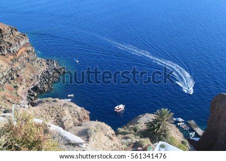 Yacht navigates into Aegean Sea, beautiful blue water, view from Santorini 
Island, Greece.