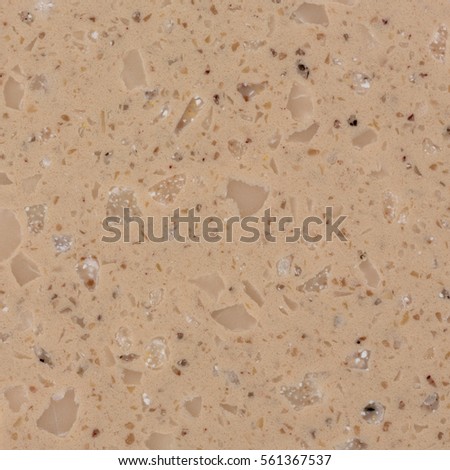 Close up of beige artificial stone detail with vignete. High resolution photo.