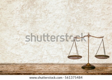 Law Scale on table.vintage Royalty-Free Stock Photo #561375484