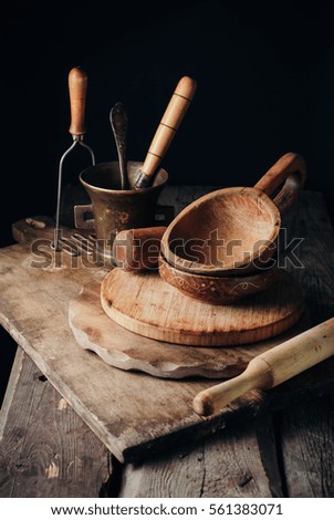vintage kitchen tools accessories on a rustic wooden table. wood and brass. toned picture