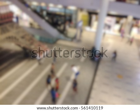 Blurred people walking inside shopping mall