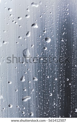 Drops of rain on the glass window