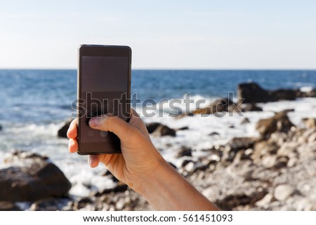 Man photographs of coastline day