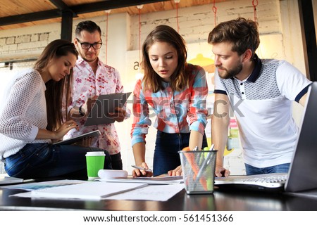 Startup Diversity Teamwork Brainstorming Meeting Concept.Business Team Coworkers Sharing World Economy Report Document Laptop.People Working Planning Start Up.Group Young Hipsters Discussing Cafe Royalty-Free Stock Photo #561451366