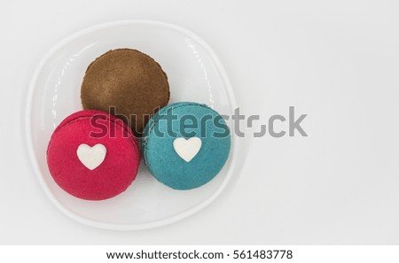 Macaroons with heart icons in the dish,isolated white background,Love&Valentine concept