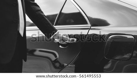 Businessman Handle Limousine Door Car Royalty-Free Stock Photo #561495553