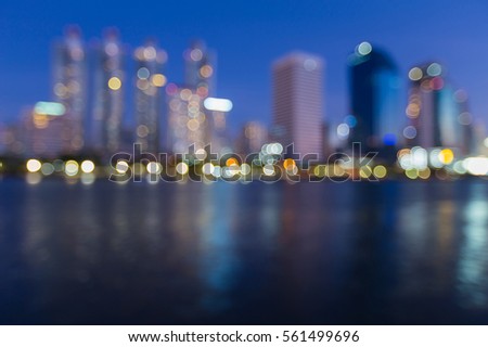 Office building blurred lights with reflection with twilight sky abstract background
