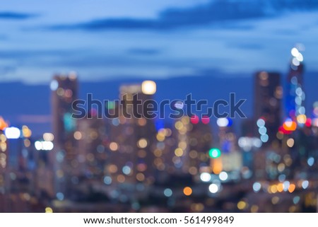 Twilight, blurred lights cityscape office building downtown, abstract background