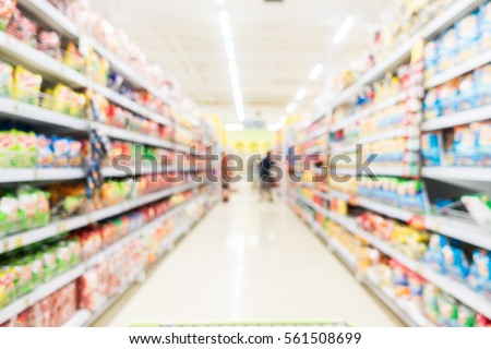 Abstract blur supermarket and retail store in shopping mall interior for background Royalty-Free Stock Photo #561508699