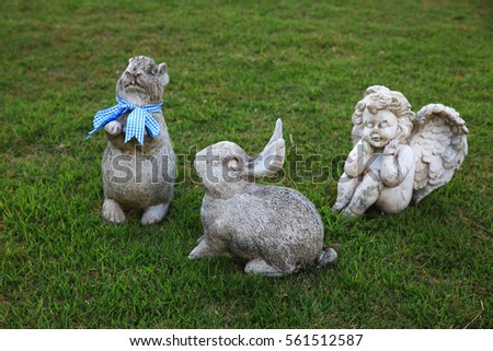 rabbit and angel doll in the garden  