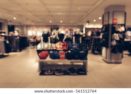 Abstract blurred photo of men clothing store in shopping mall. Shopping concept.