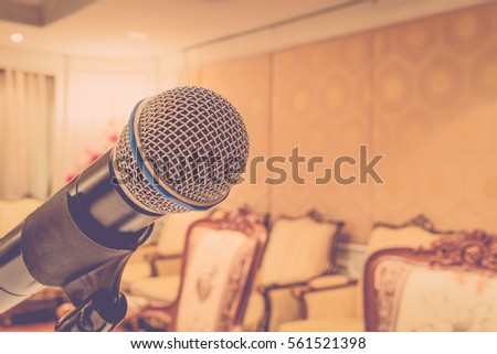 Microphone in seminar event defocus on meeting room background , process in vintage style