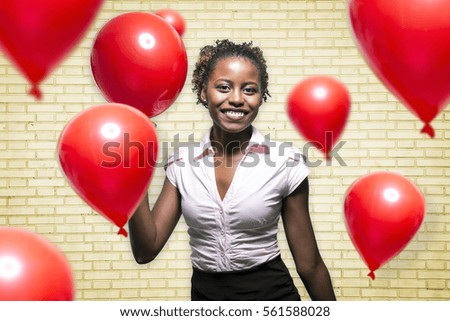 Black girl with red balloon