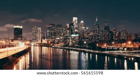Philadelphia skyline at night with urban architecture.