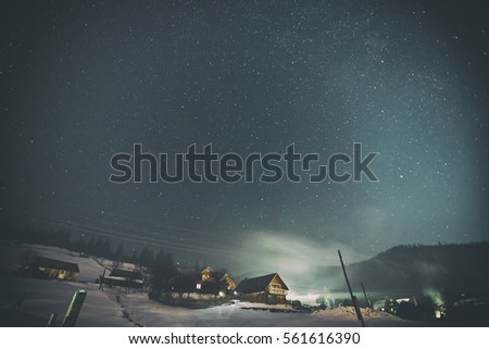 Beautiful starry night in the village in the mountains