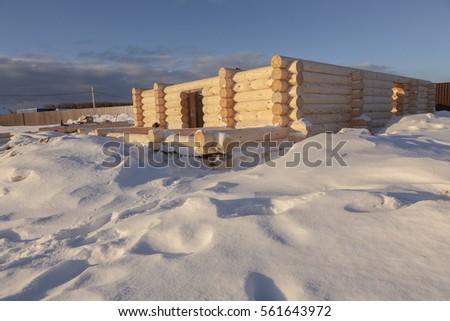 construction of wooden houses in winter and blue sky