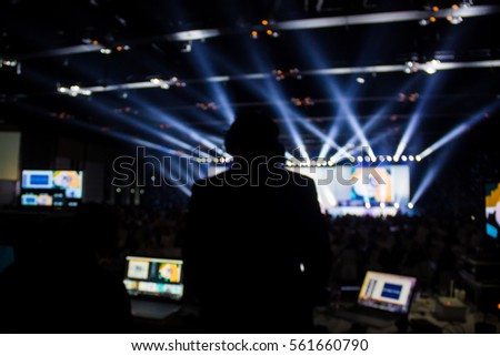 Silhouette of worker control, sound system and lighting in concert. Royalty-Free Stock Photo #561660790