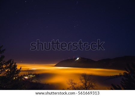 View over Brasov city and Tampa Mountain in a foggy night
Brasov is a city in the Transylvania region of Romania, ringed by the Carpathian Mountains.