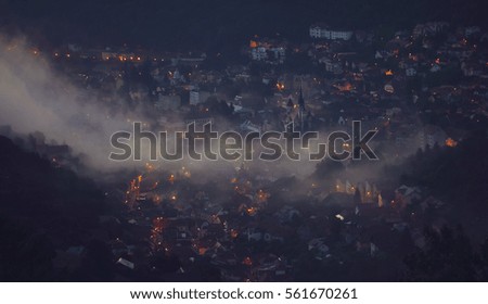 View over Brasov city and Tampa Mountain in a foggy night
Brasov is a city in the Transylvania region of Romania, ringed by the Carpathian Mountains.