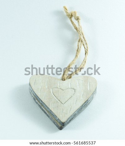 Wooden heart necklance on a white background