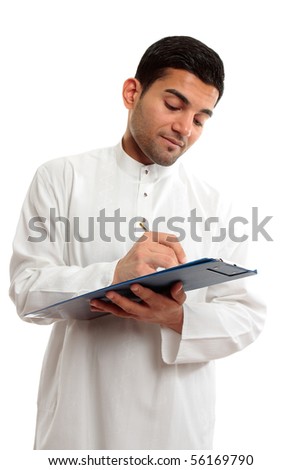 An ethnic businessman in traditional clothing, holding a clipboard folder and writing with a pen.  White background.