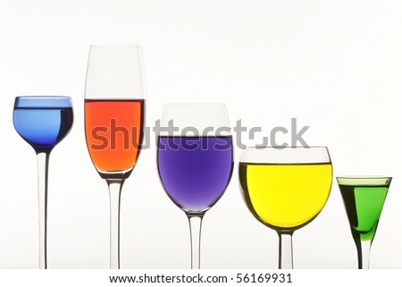 Five multi-coloured wine-glasses on white background