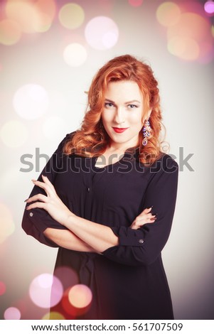 portrait of a beautiful red-haired girl on an abstract background.