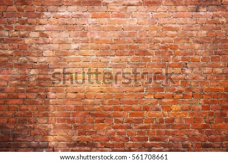 Old brick wall, old texture of red stone blocks closeup Royalty-Free Stock Photo #561708661
