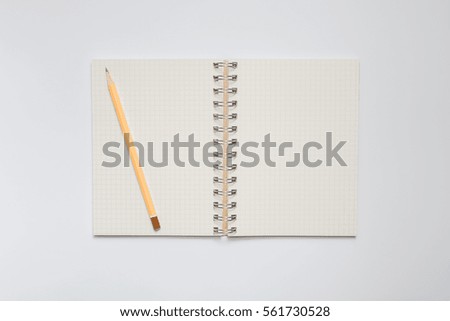 School notebook with yellow pencil, office concept top view