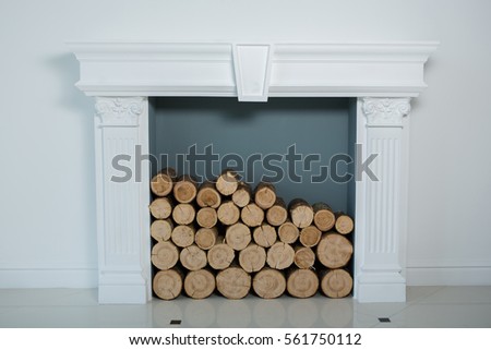 Fireplace mantel or mantelpiece with  firewood