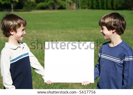 Boys Holding A Message