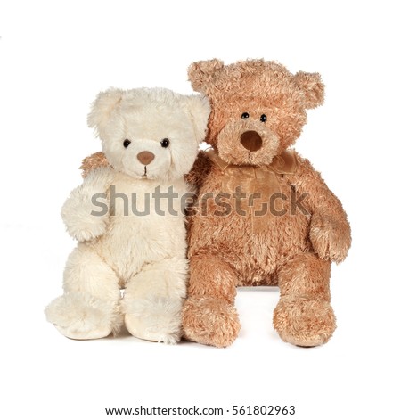 white and brown teddy bear that hugs Royalty-Free Stock Photo #561802963
