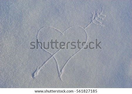 Hand drawing on the snow surface. Winter greeting background.