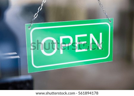 Close-up Of Open Tag Inside The Window Shop