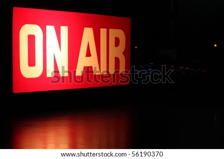 On-Air studio sign glowing with red reflection and copy space. Royalty-Free Stock Photo #56190370