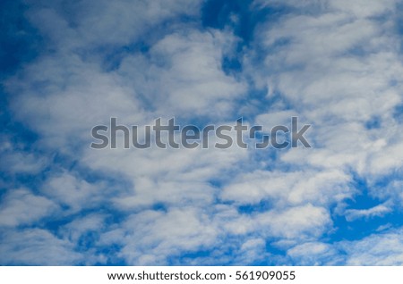 White clouds in a deep blue sky