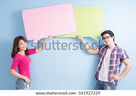 young couple take speech bubble isolated on blue background