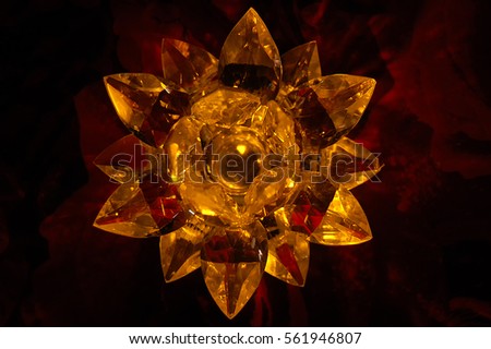 flower candlestick of glass in a dark