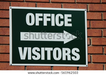 OFFICE VISITOR WITH ARROW SIGN