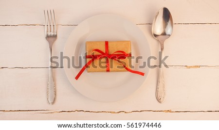 Kitchen utensils spoon and fork on red background, love, Valentine's day
