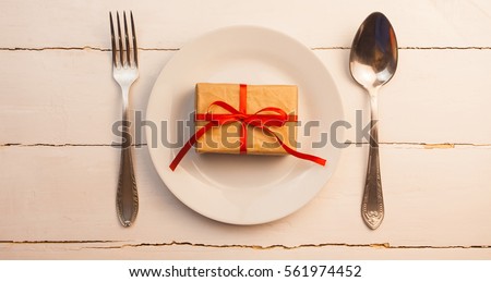 Kitchen utensils spoon and fork on red background, love, Valentine's day