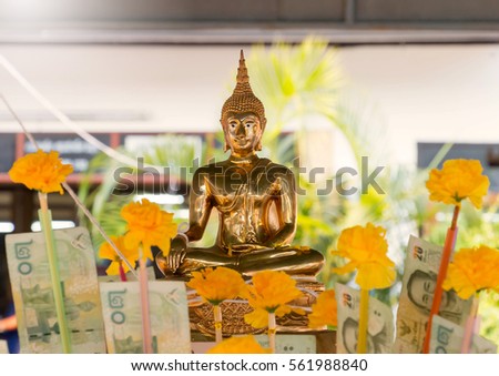 golden buddha in temple on Thai new year day Royalty-Free Stock Photo #561988840