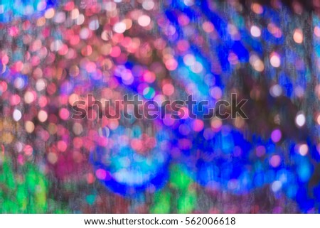 Abstract circular light bokeh New Year Festive background of defocused decorated xmas tree bokeh composition
