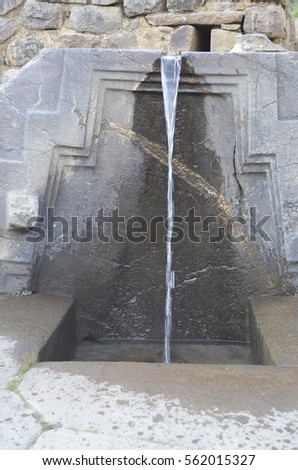 Stone fountain at the Inca fortress of Ollantaytambo, in the Sacred Valley, Peru