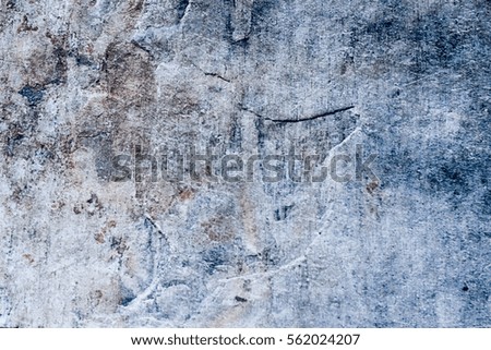 Photograph of a stone cracked wall texture or background