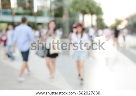 Abstract blurred image of asian young adult women  walking at shopping center use for background.