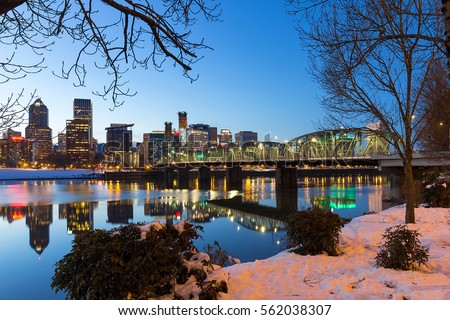 Portland Oregon downtown snow on the banks of Willamette River winter night scene