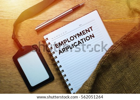 Business Concept, Top view shows the name tags, pens, and notebooks written Employment Application