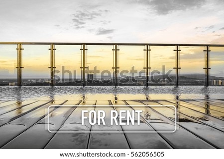 Sunset over an infinity swimming pool with word FOR RENT