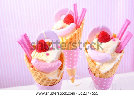 Happy Valentines Day, I love you more than Ice Cream, cones decorated with candy against a pink candy stripe background.